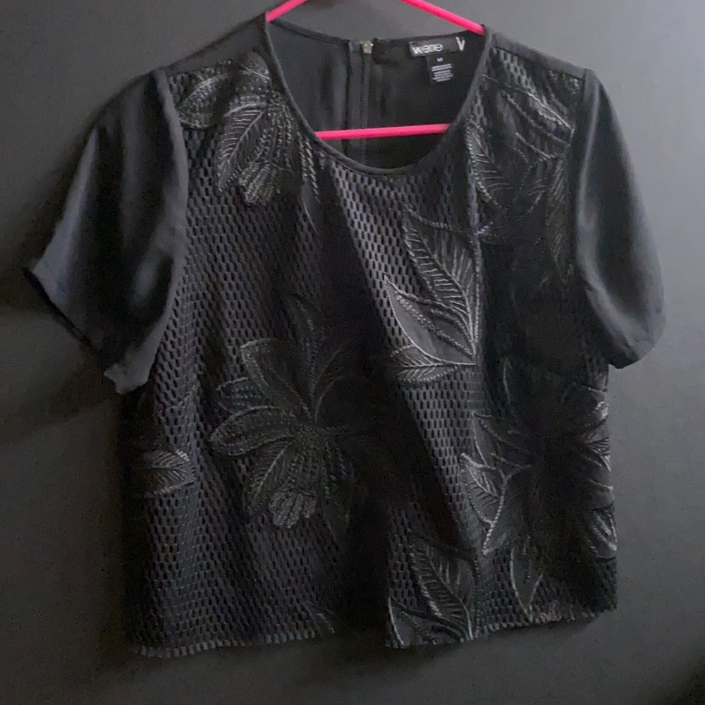 Black monochromatic shirt with subtle leaf cutout